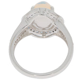 Detail view of an Oval White Opal Sterling Silver Ring showcasing the silver band and opal gemstone on top.